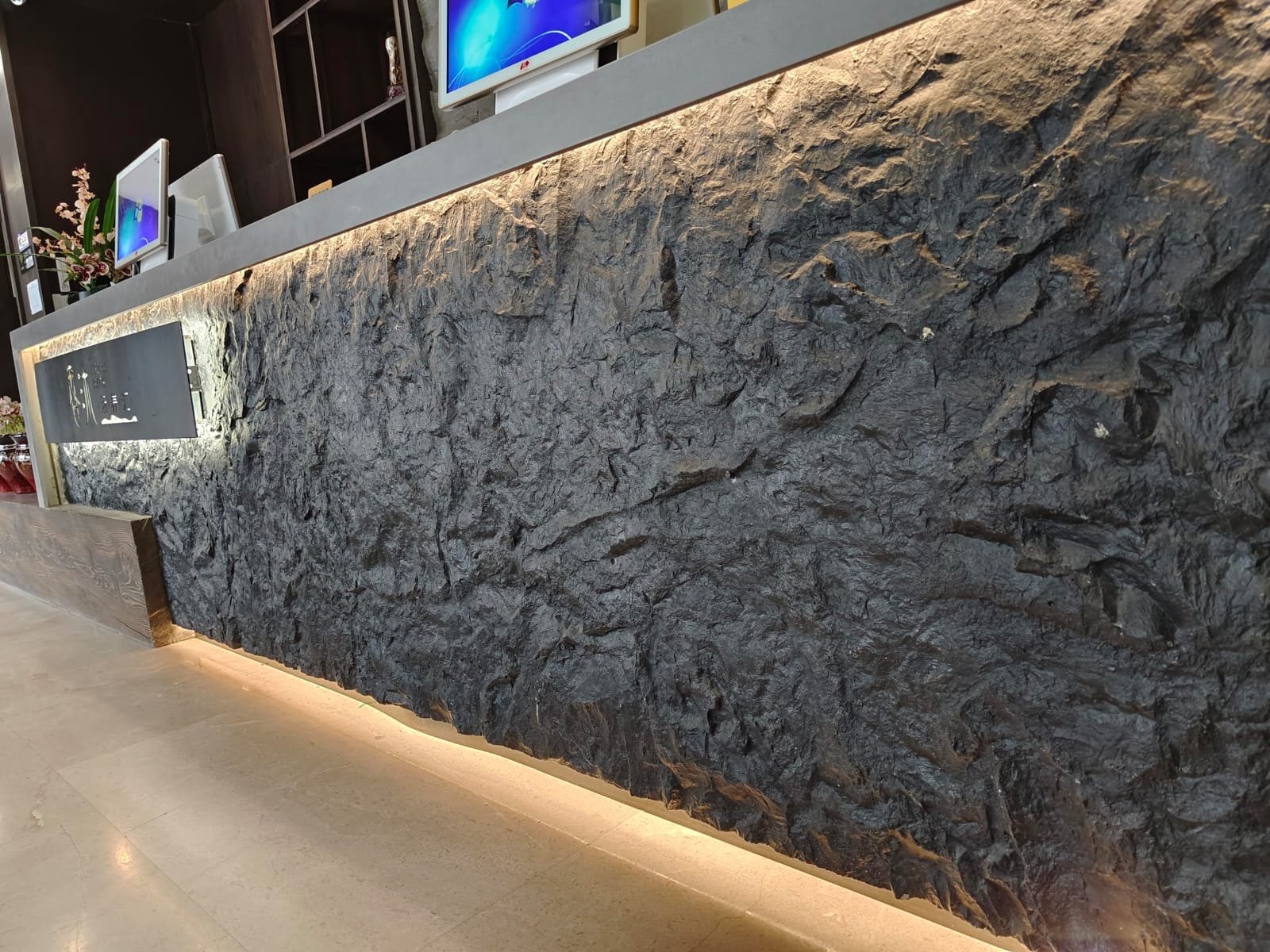 Authentic dark basalt geological striations and hand-chiseled mineral textures
